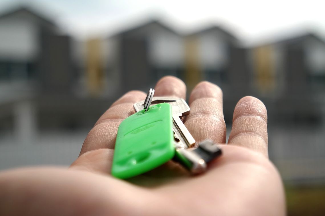 Man holding house keys in his palm 